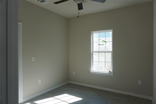 empty room featuring wood-type flooring and ceiling fan