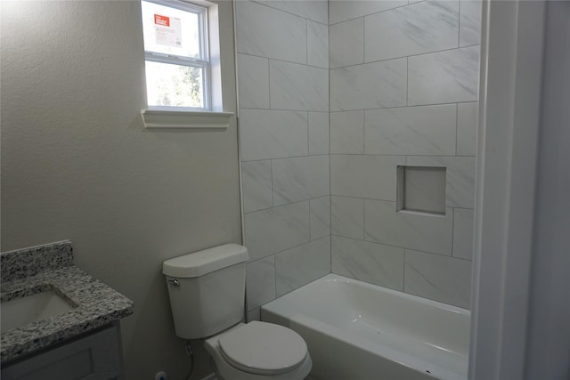 full bathroom featuring vanity, toilet, and tiled shower / bath combo