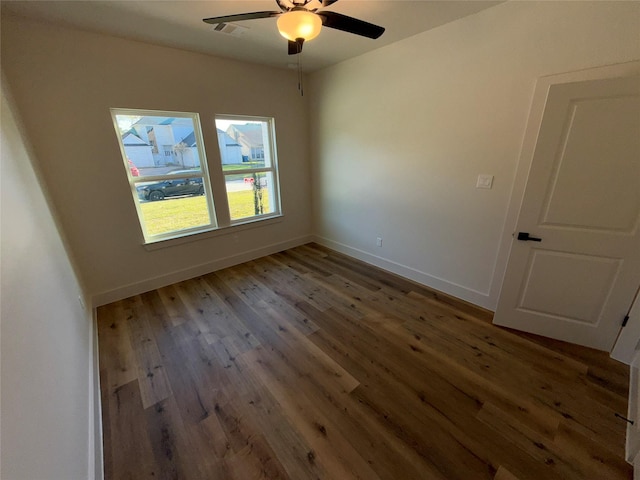 unfurnished room with hardwood / wood-style floors and ceiling fan