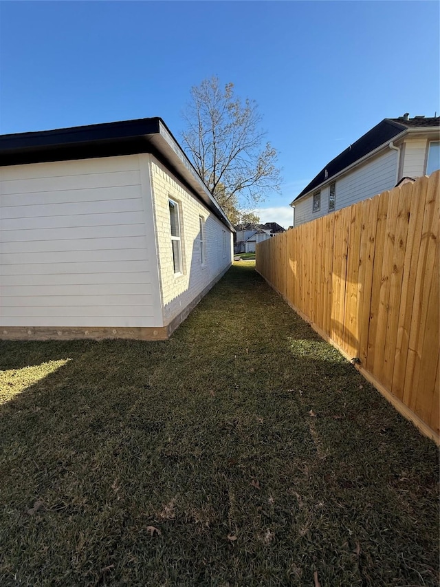 view of property exterior with a lawn