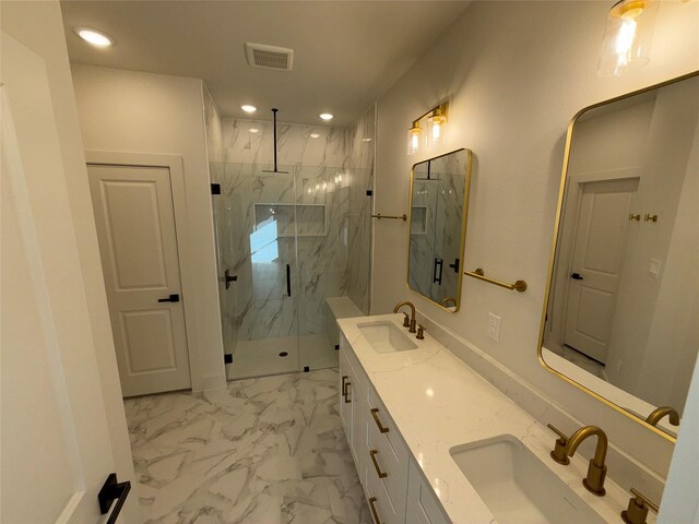 bathroom featuring vanity and a shower with shower door