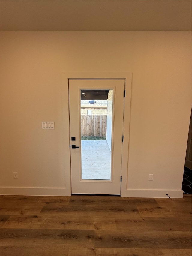 doorway to outside featuring hardwood / wood-style flooring