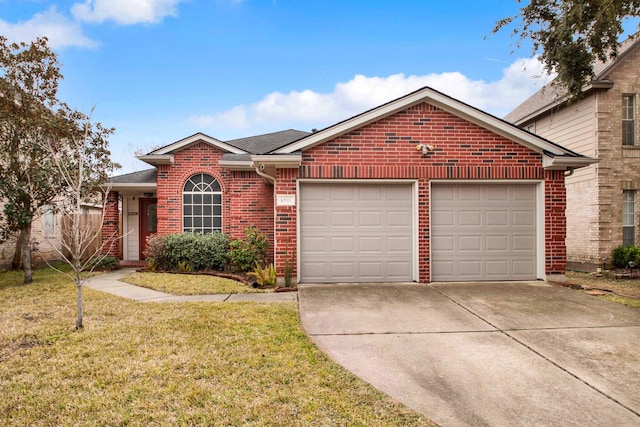 view of front of property featuring a garage and a front lawn