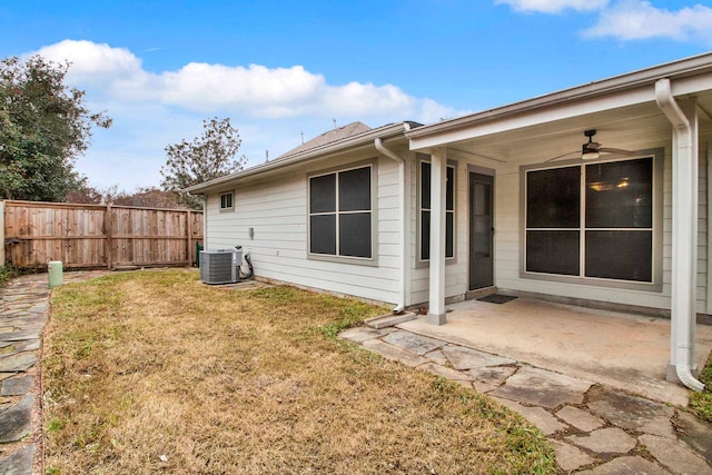 exterior space featuring cooling unit, a lawn, a patio, and ceiling fan