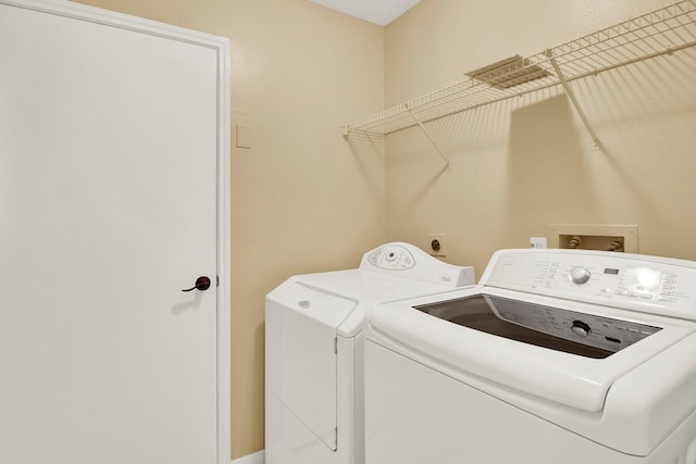 laundry area featuring washer and clothes dryer