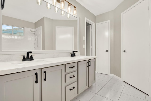 bathroom with walk in shower, tile patterned floors, and vanity