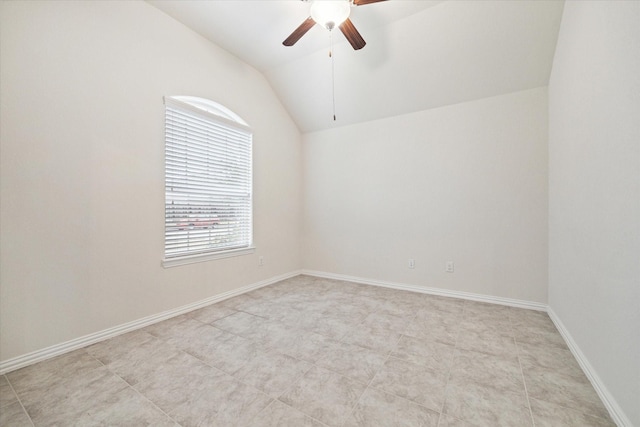 unfurnished room with ceiling fan and lofted ceiling