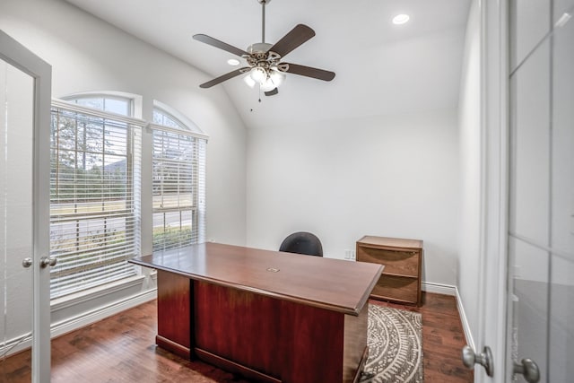 office space with dark wood-type flooring, vaulted ceiling, and ceiling fan