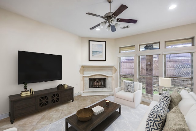 living room with light tile patterned flooring and ceiling fan