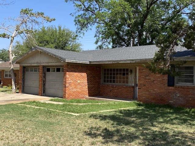 single story home featuring a garage and a front yard