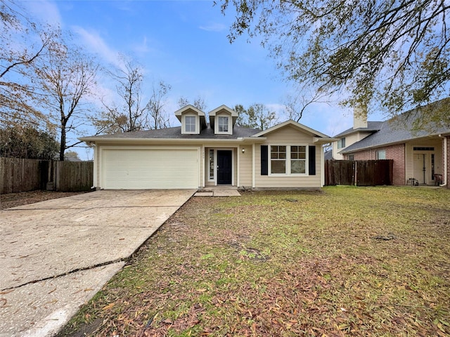 view of front of home featuring a garage and a front lawn