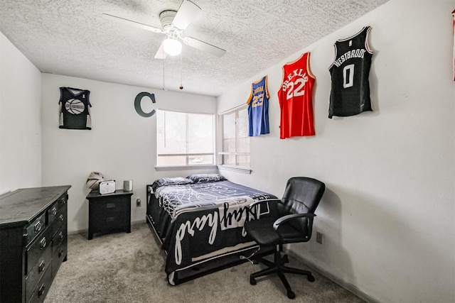 bedroom with light carpet, a textured ceiling, and ceiling fan