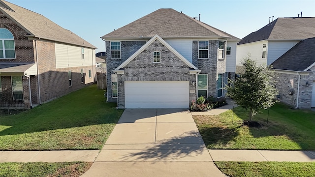 front facade with a garage and a front yard