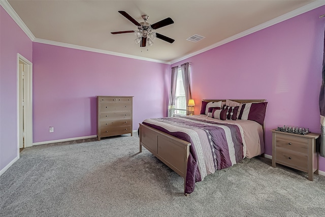 carpeted bedroom featuring ornamental molding and ceiling fan