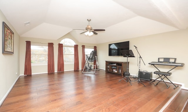 living room with wood-type flooring, ceiling fan, and vaulted ceiling