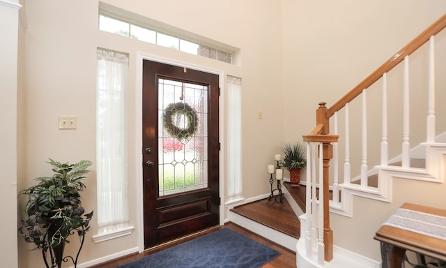 foyer with dark hardwood / wood-style flooring