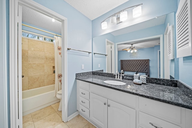 full bathroom with vanity, shower / tub combo, toilet, tile patterned floors, and a textured ceiling