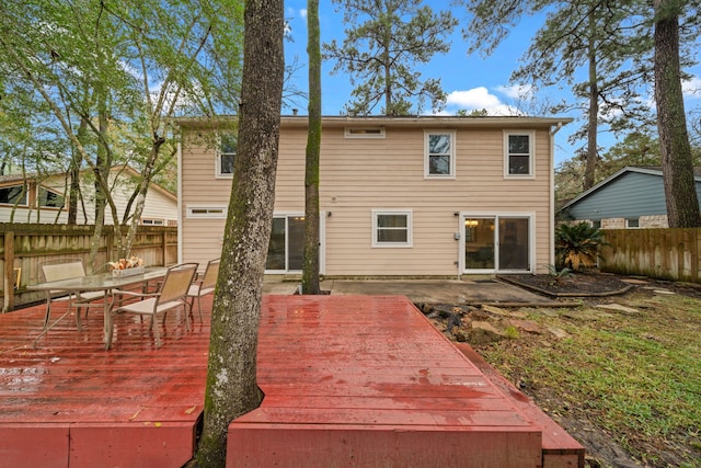 rear view of house with a wooden deck