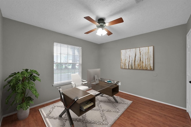 office with wood-type flooring, a textured ceiling, and ceiling fan