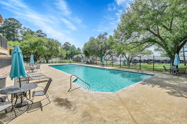 view of swimming pool with a patio