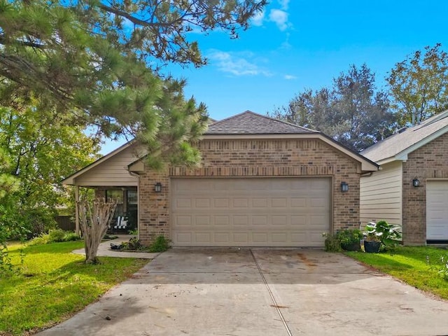 ranch-style house with a garage and a front yard