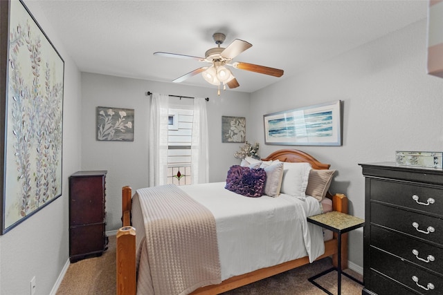 bedroom featuring ceiling fan and carpet