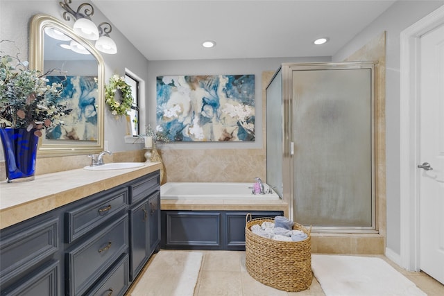 bathroom with vanity, tile patterned floors, and separate shower and tub