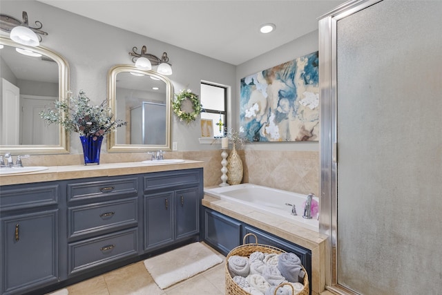 bathroom with tile patterned flooring, vanity, and independent shower and bath