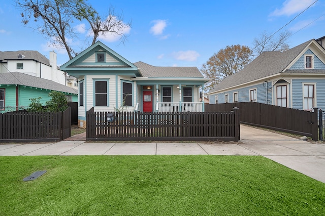 view of front of property with covered porch and a front lawn