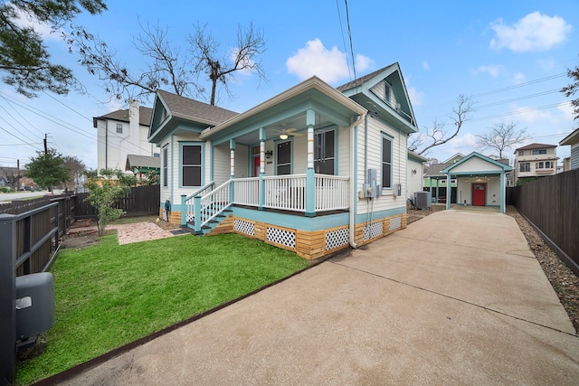 bungalow-style house with central AC, a front lawn, and a porch