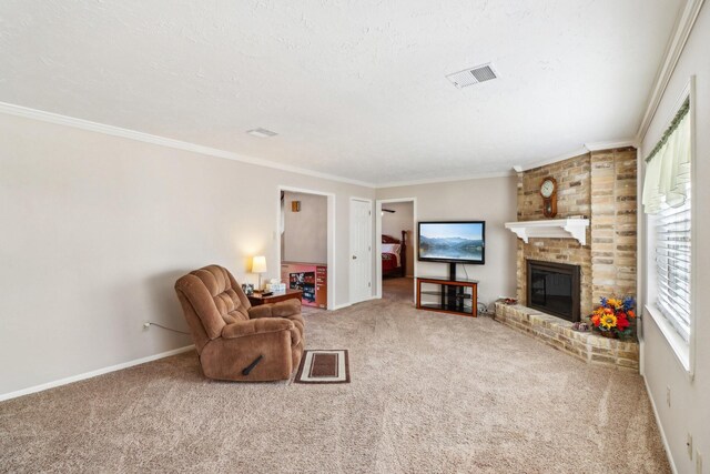 living room with ornamental molding, a fireplace, carpet floors, and a textured ceiling