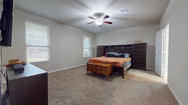 bedroom with light colored carpet and ceiling fan