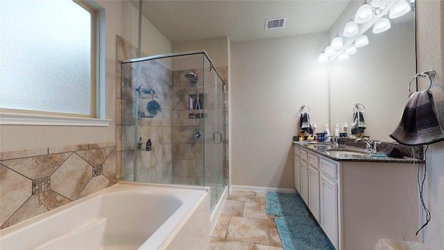 bathroom featuring vanity and separate shower and tub