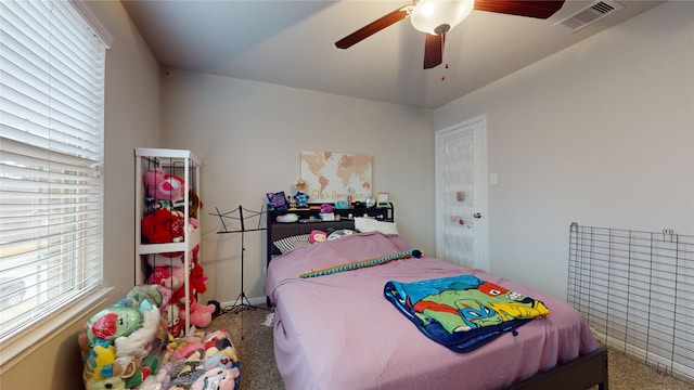 carpeted bedroom with ceiling fan