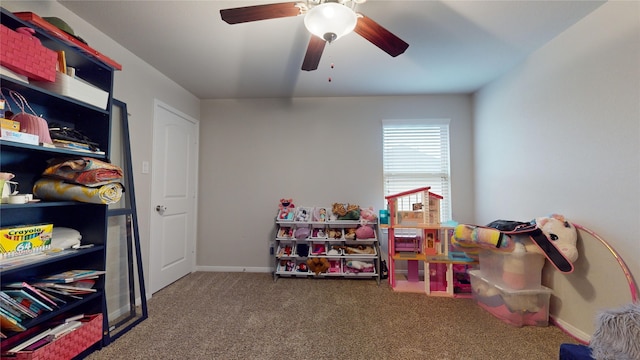 game room with ceiling fan and carpet flooring