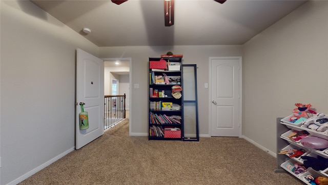 playroom featuring ceiling fan and carpet