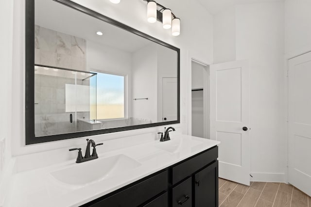 bathroom with vanity and an enclosed shower