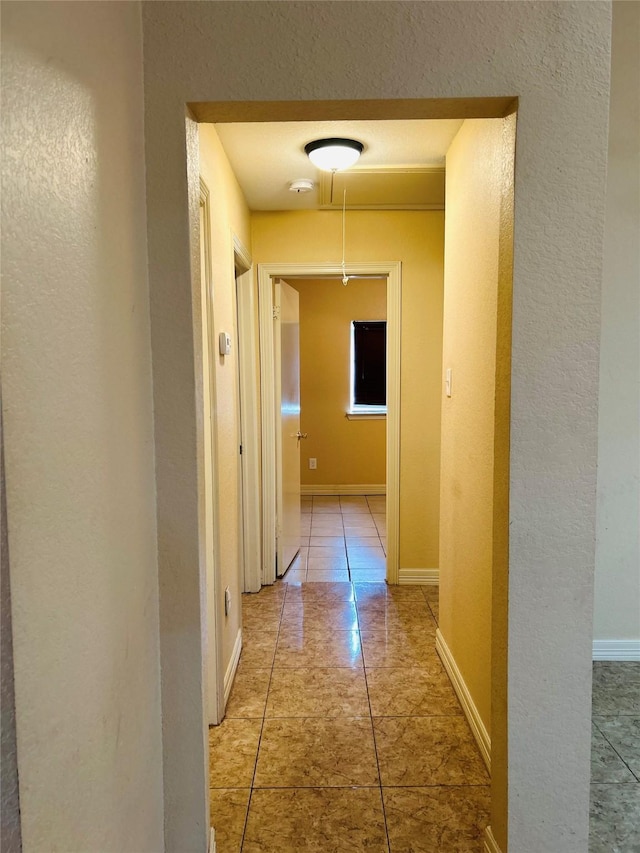 hallway featuring tile patterned floors