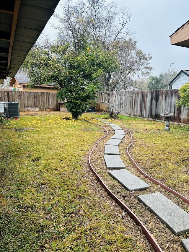 view of yard featuring central AC