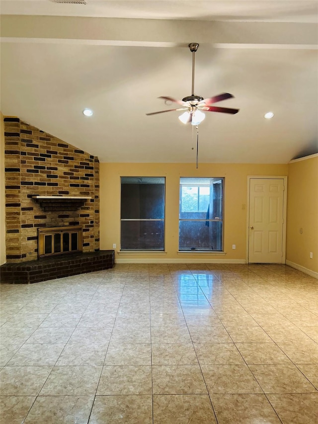 unfurnished living room featuring vaulted ceiling, ceiling fan, and a fireplace