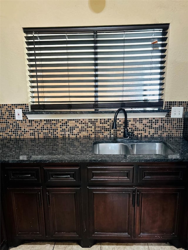 interior space featuring sink and decorative backsplash