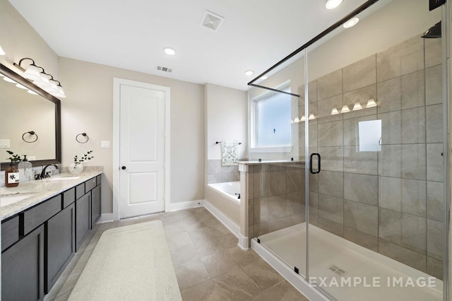 full bathroom featuring a bath, a sink, a shower stall, and visible vents