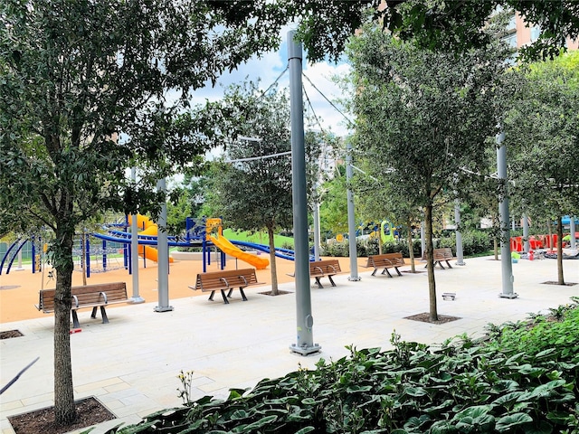 view of property's community with a playground