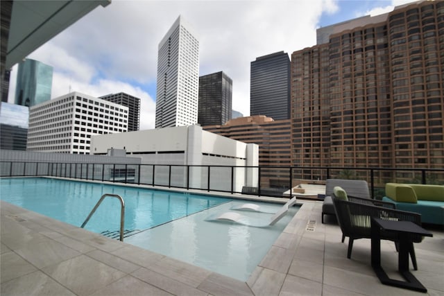 view of swimming pool featuring a patio area