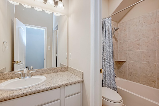 full bathroom featuring shower / tub combo with curtain, vanity, and toilet