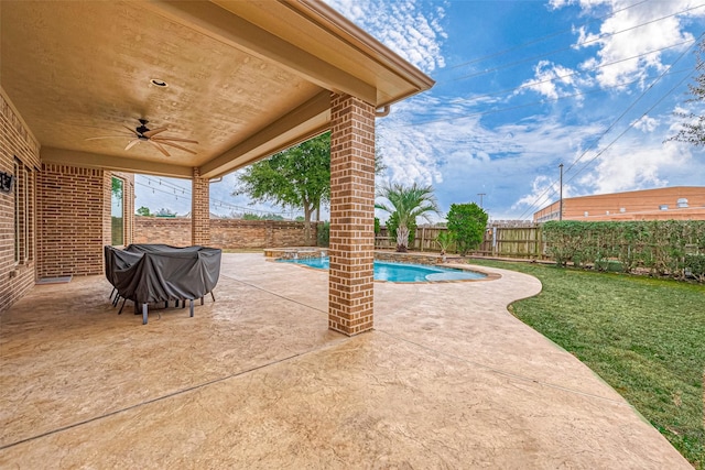 view of patio with a fenced in pool, a grill, and ceiling fan