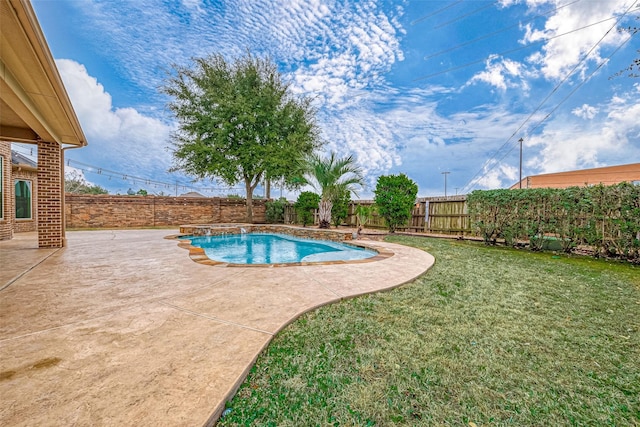 view of swimming pool with a patio and a lawn