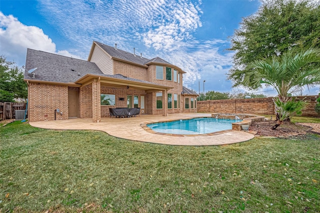 view of pool featuring a hot tub, a yard, central air condition unit, and a patio area