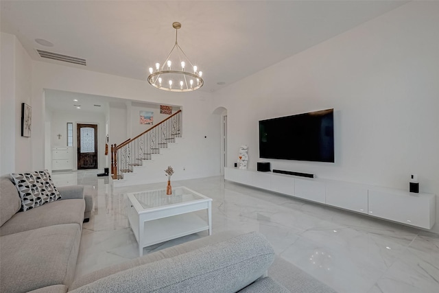 living room with a notable chandelier