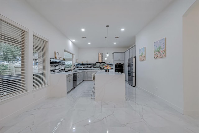 kitchen with pendant lighting, gray cabinets, extractor fan, black appliances, and a kitchen island